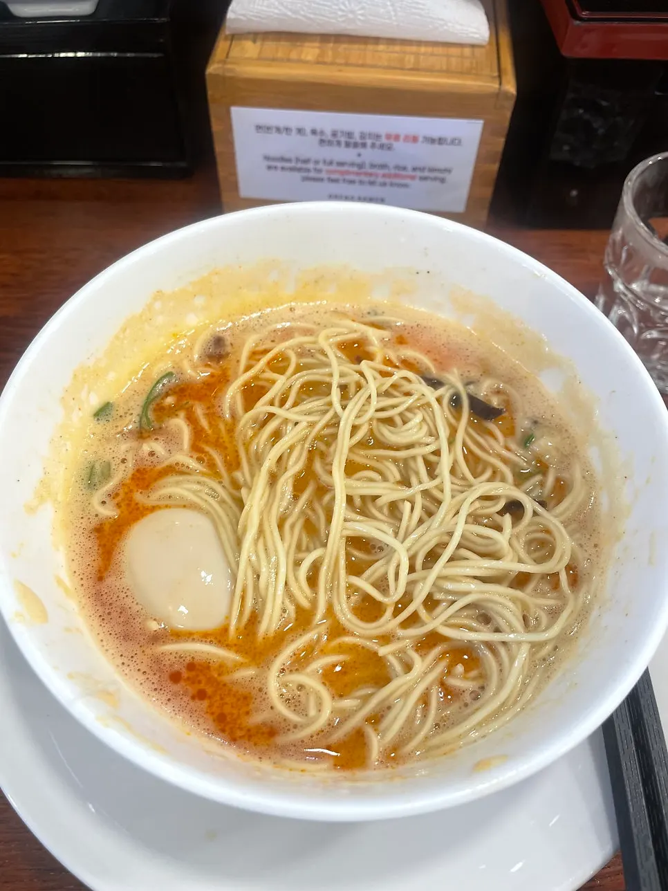 Table with noodle and rice refill signage