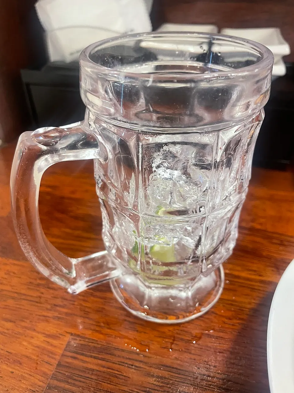 An emptied lime highball glass