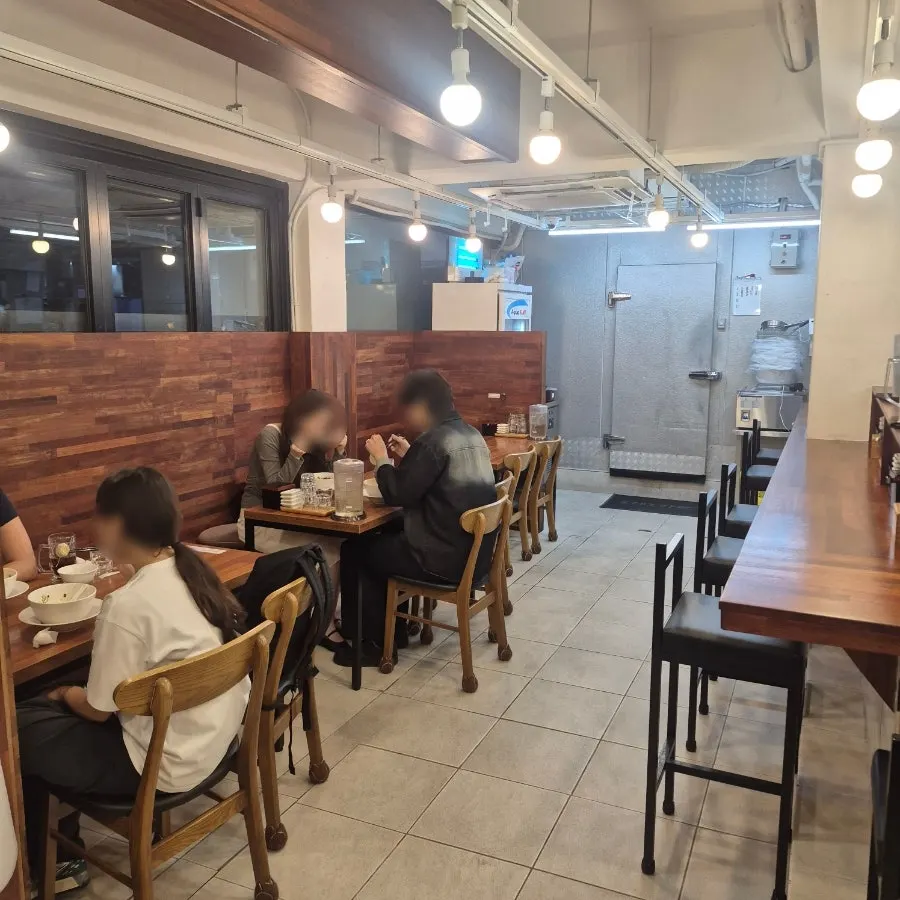Bar table and open kitchen at Oreno Ramen Eunpyeong