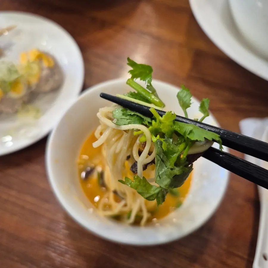 Kara paitan ramen topped with cilantro