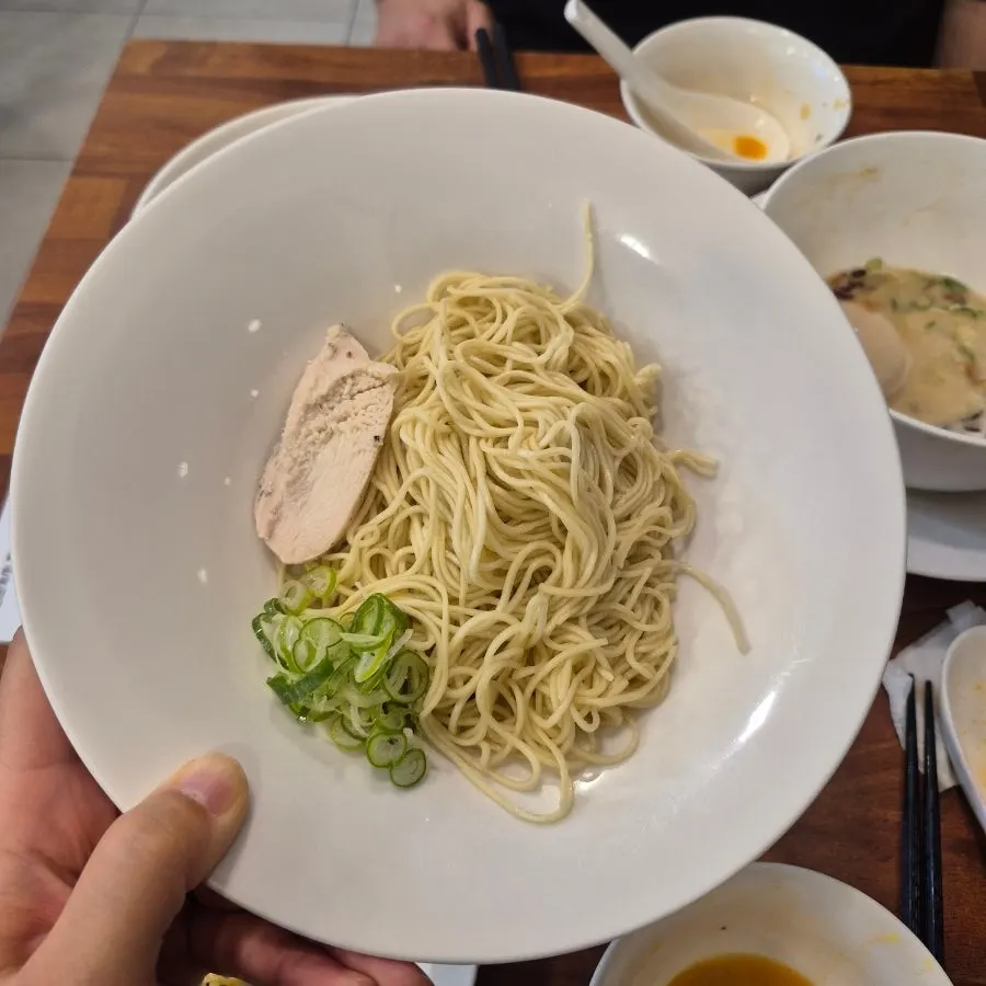 Rice dunked into the ramen broth