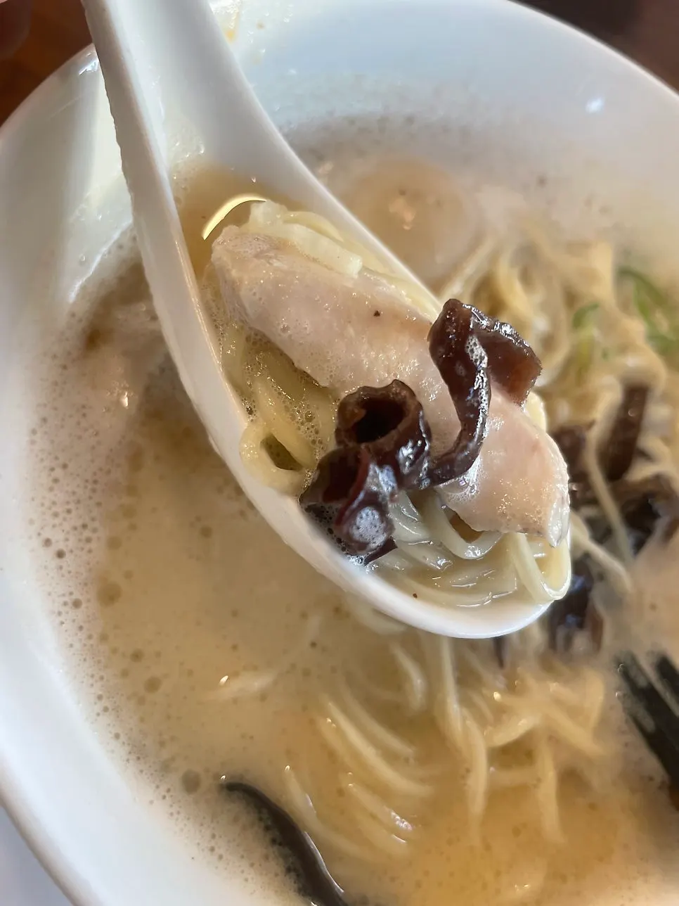Table setting for three, with mild and spicy ramen bowls together
