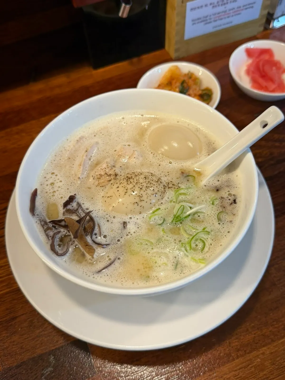 A bowl of tori paitan ramen with its pale broth