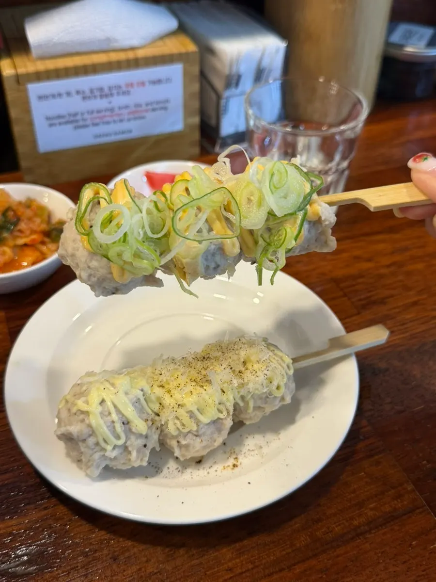 Round chicken meatball tsukune arranged on a plate