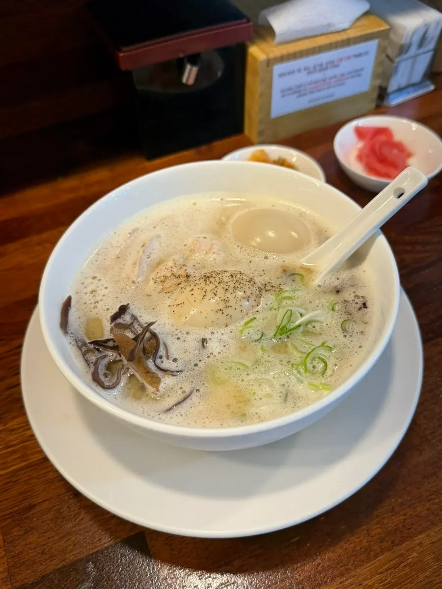 Full spread of tori paitan, tsukune, and draft beer