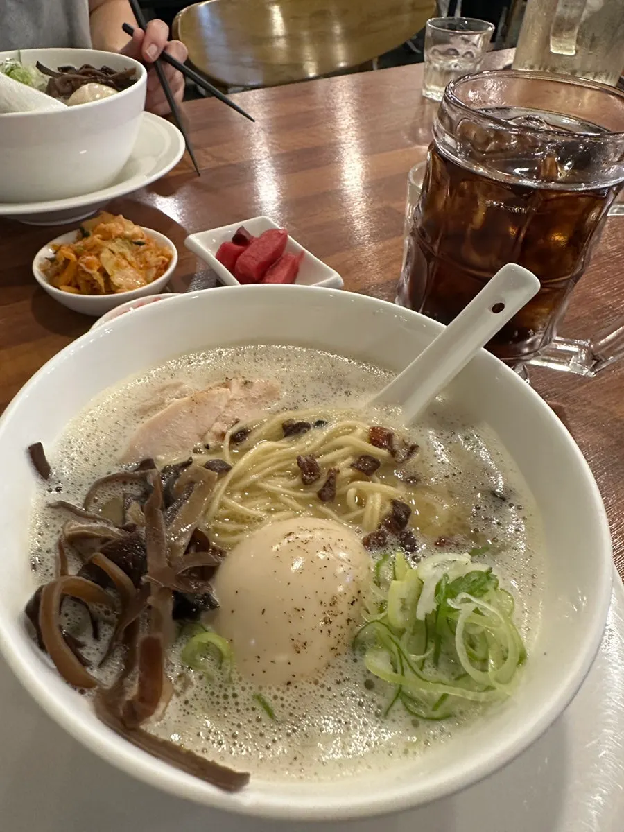 Lifting up the sous-vide chicken and chashu