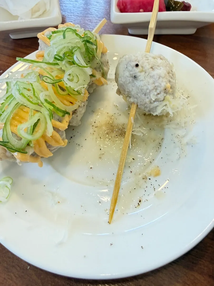 A partly eaten bowl of ramen