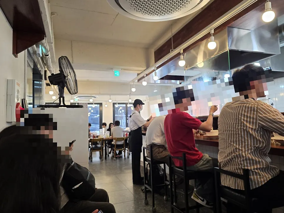 Line of waiting customers on the stairs up to the second-floor restaurant