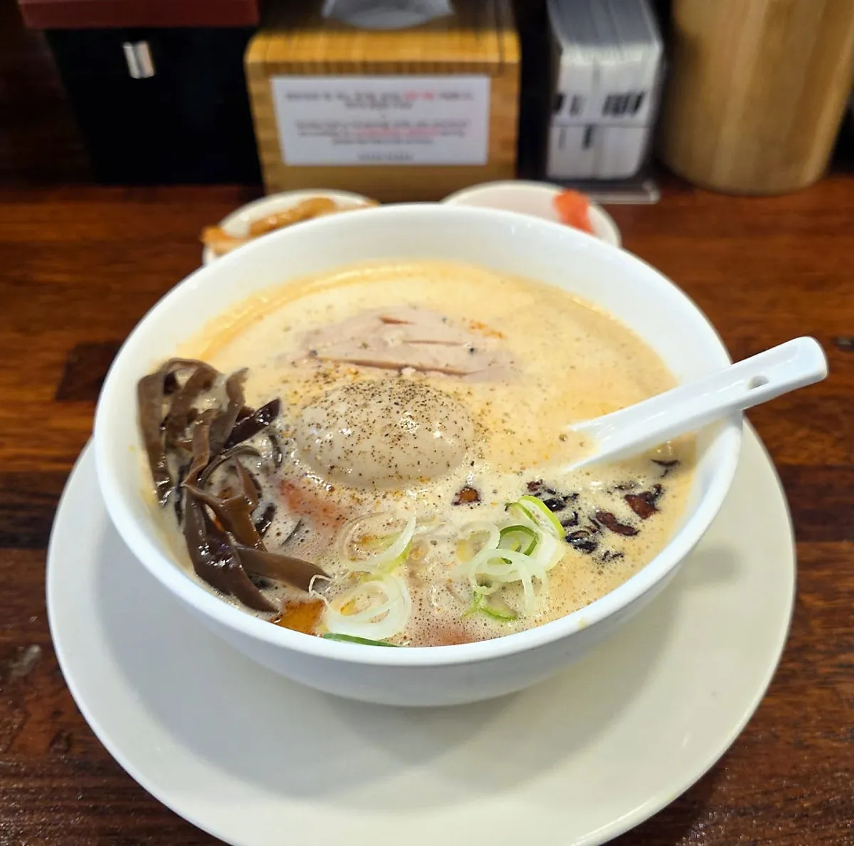 Kara paitan ramen served alongside Sapporo draft beer