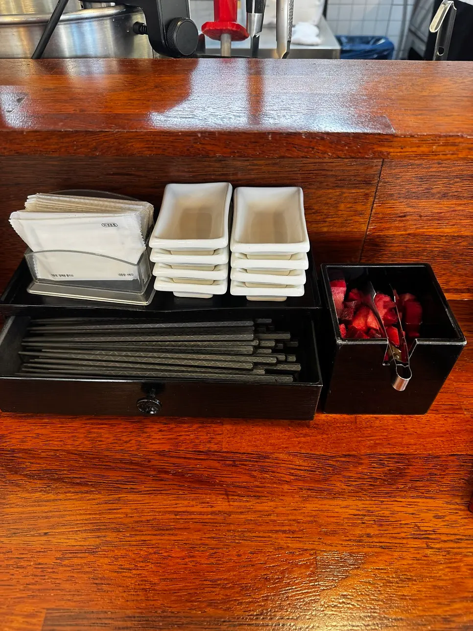 A neatly set table with personal dishware and a cup