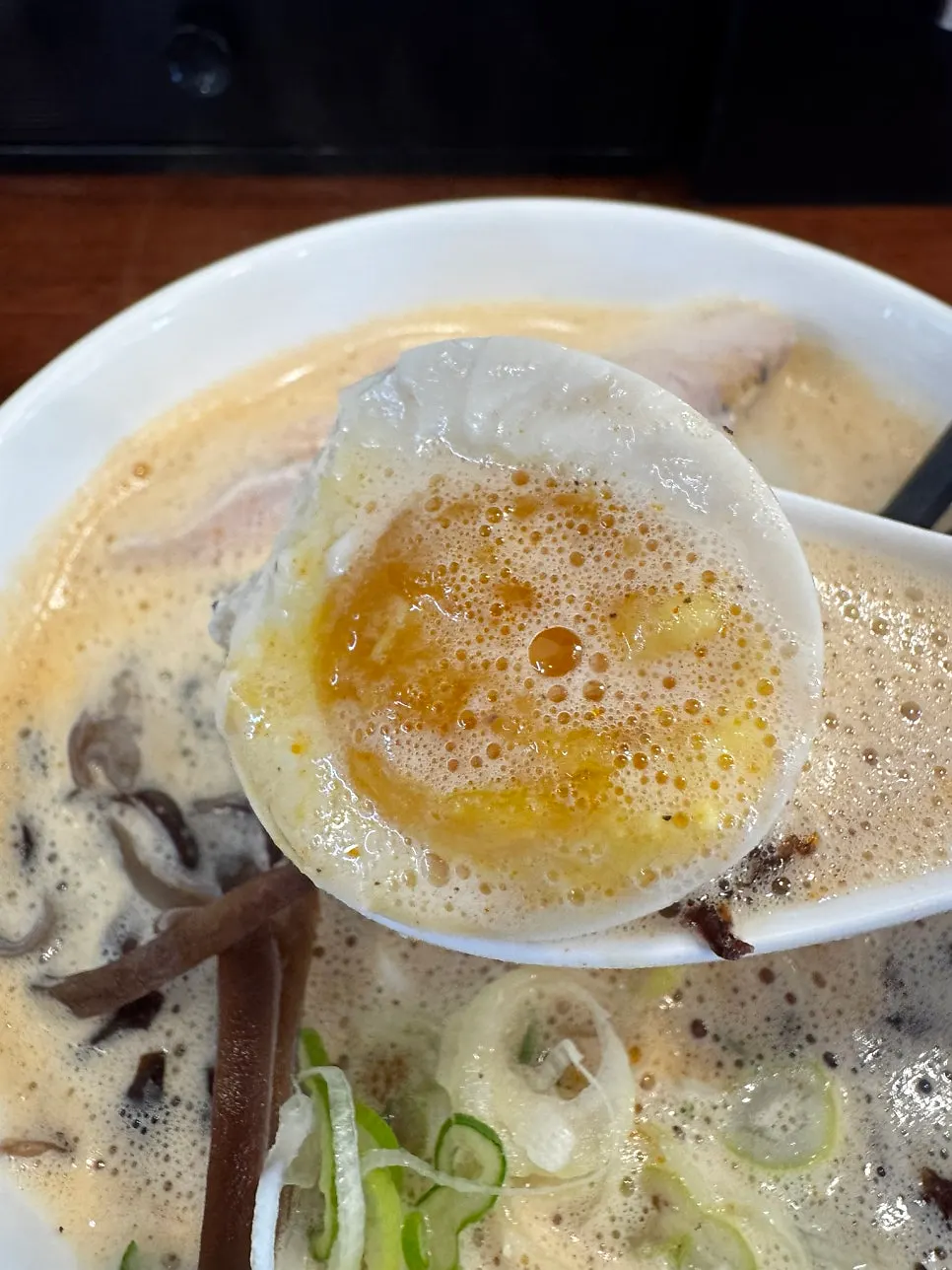 Soft-boiled egg with the yolk flowing out