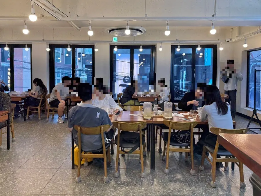 Spacious interior with table seating in the back