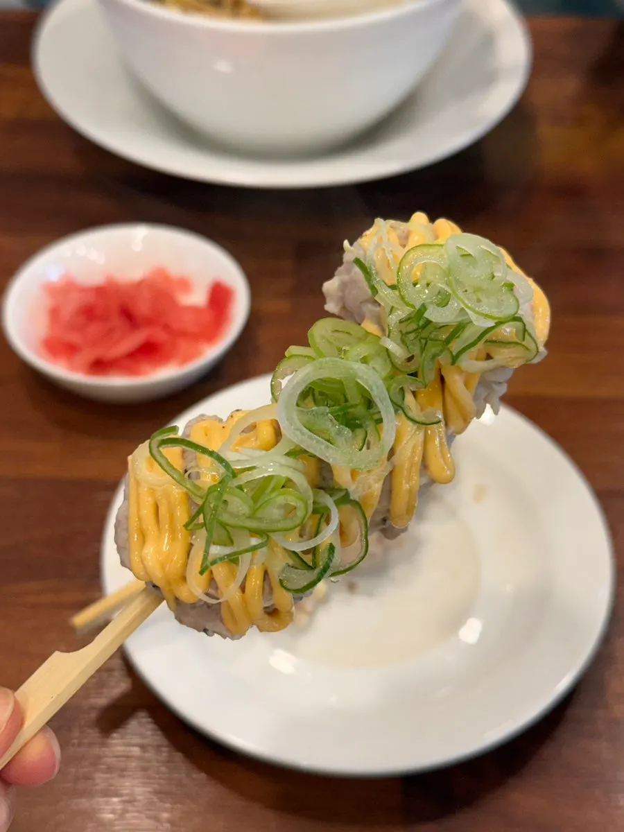 Picking up a piece of tsukune