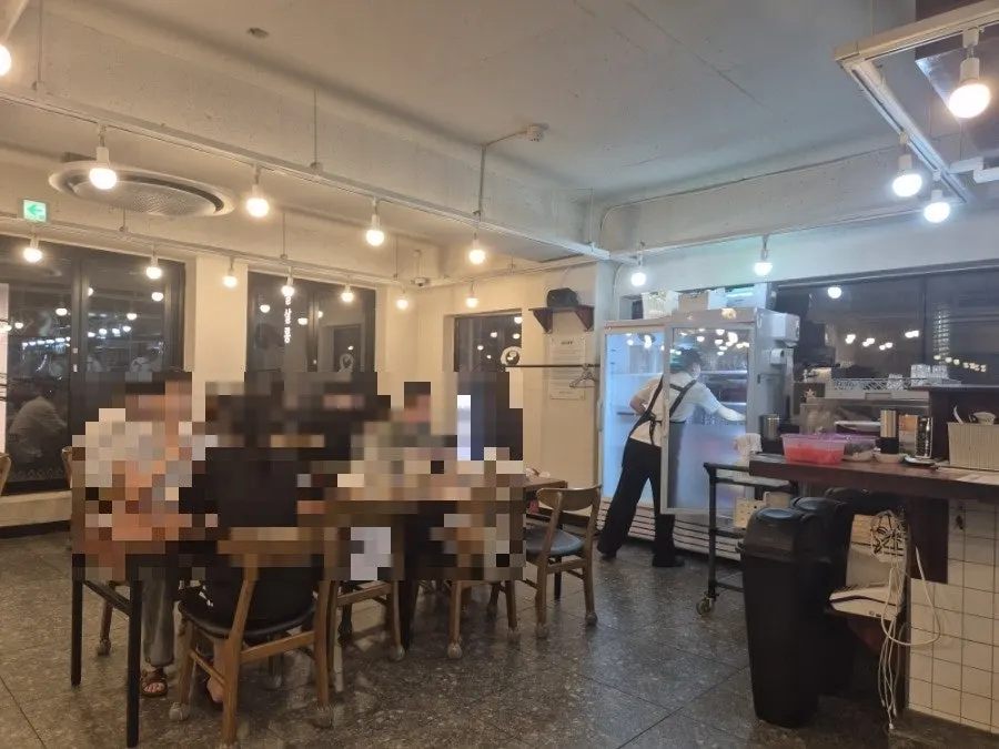Spacious dining hall with wide table spacing at Oreno Ramen Gangnam