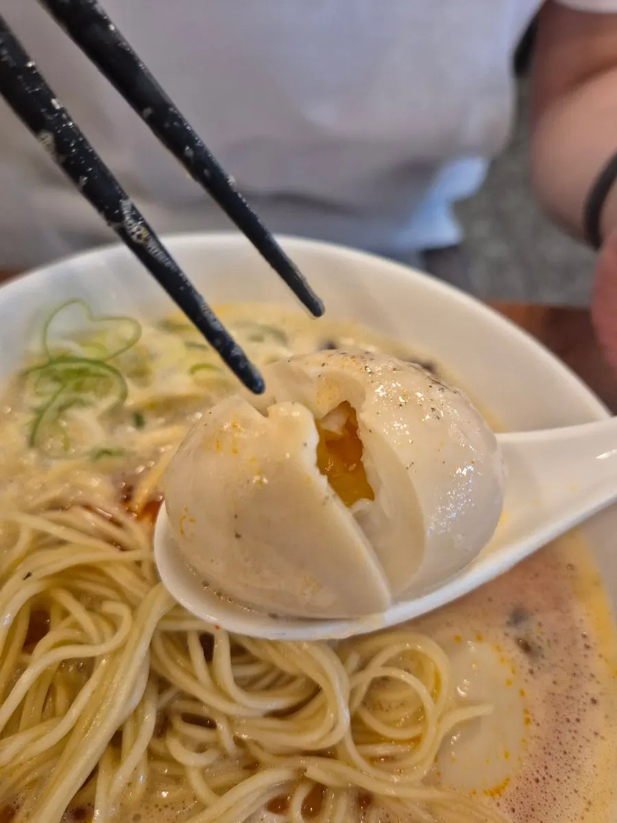 Spicy karapaitan broth topped with foam