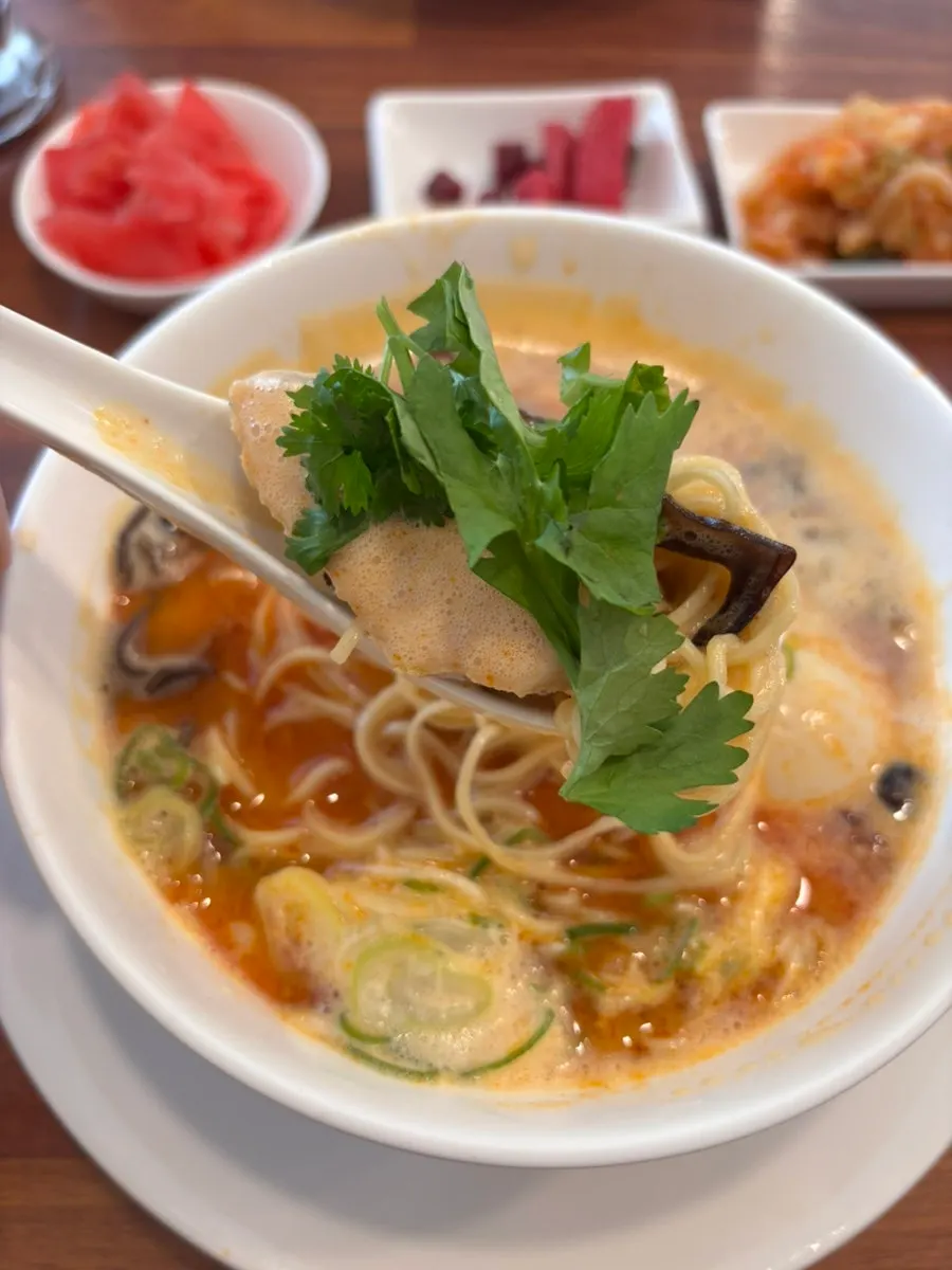 Cilantro placed on top of the ramen