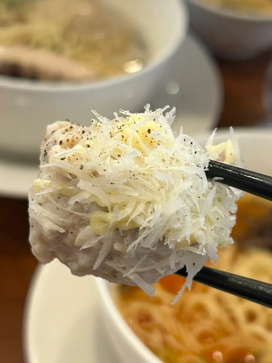 Tsukune topped with cheese sauce