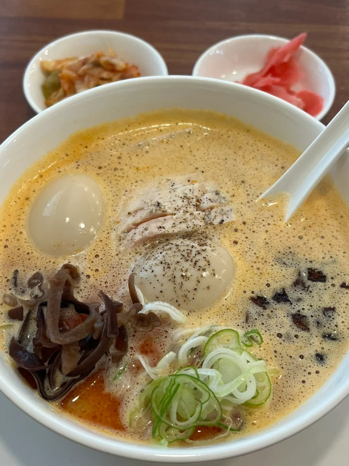 Close-up of kara paitan ramen with toppings