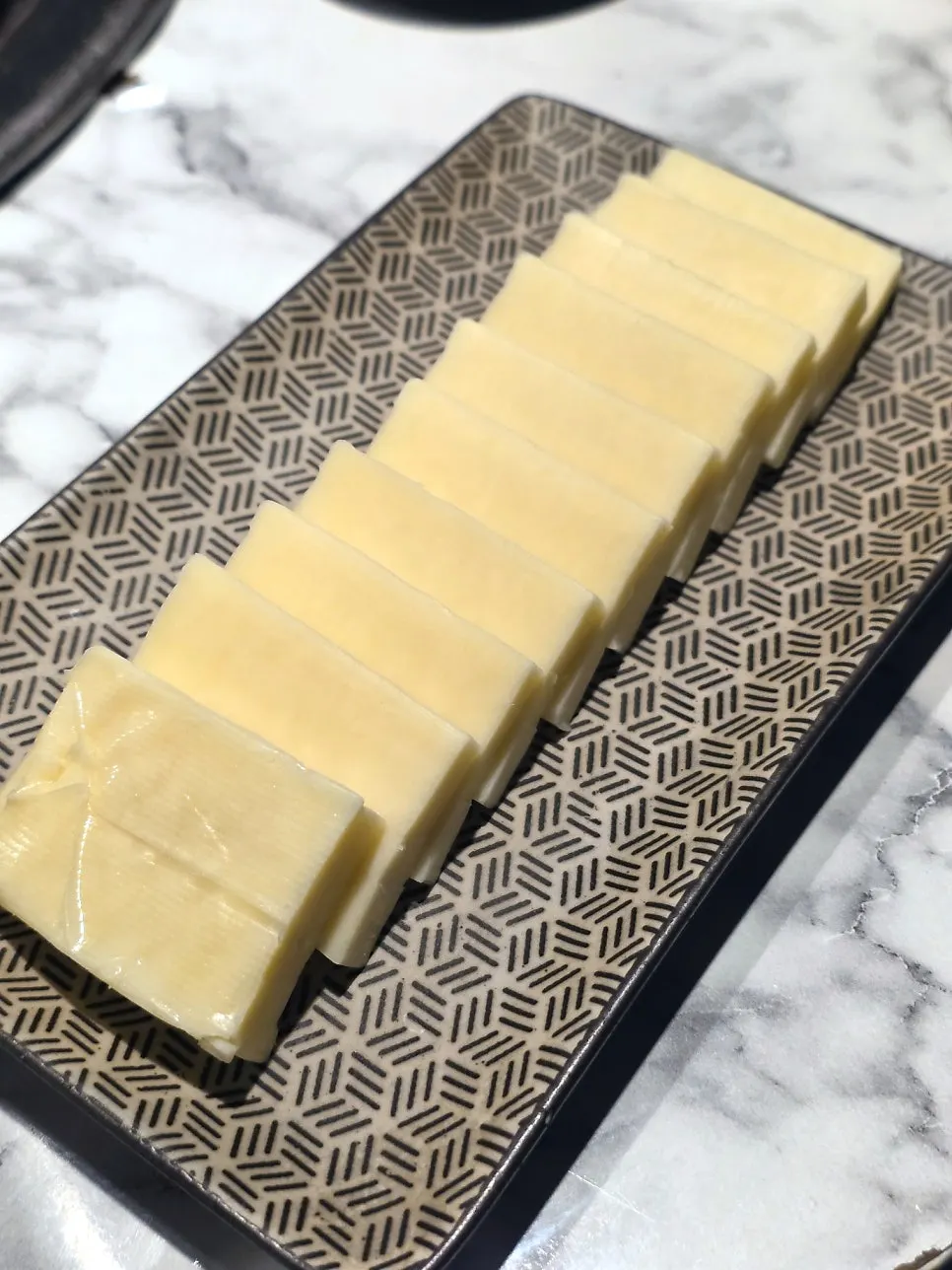 100g of grilling cheese cooking on the pan