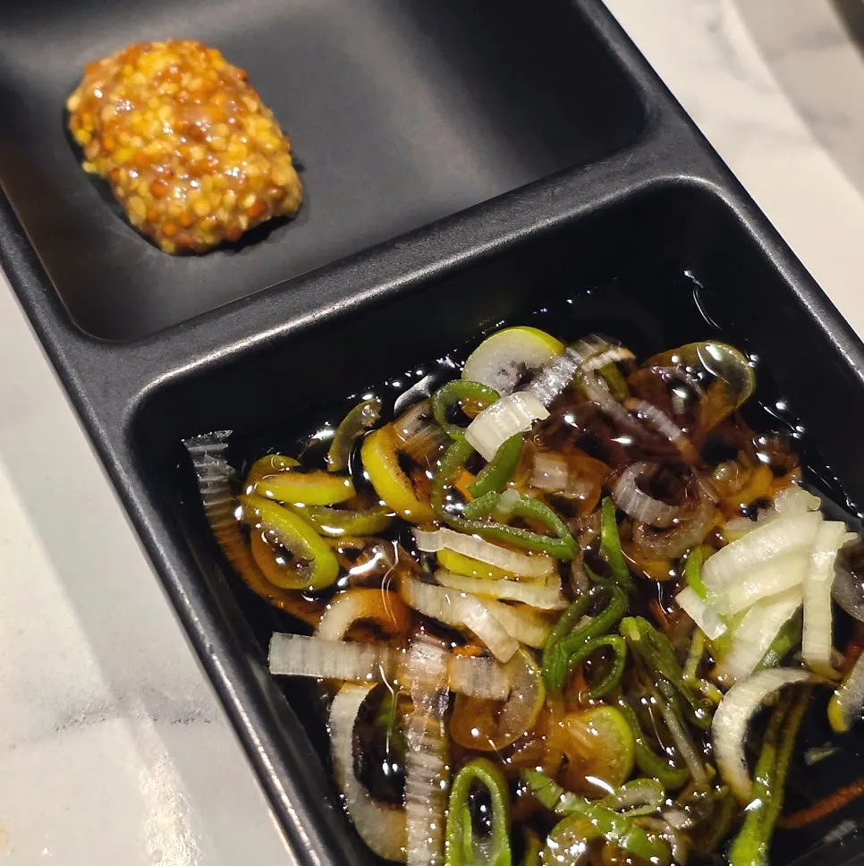 Whole grain mustard and scallion soy sauce served with the beef