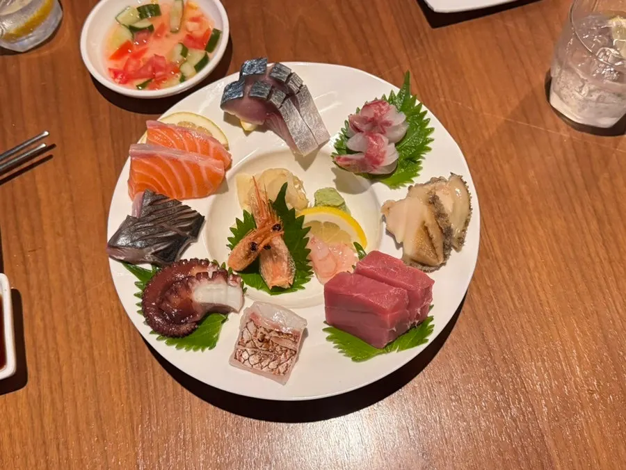 Assorted sashimi and ankimo brûlée on the table
