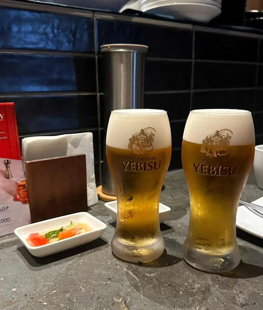 A glass of Yebisu draft beer at Orot Robata
