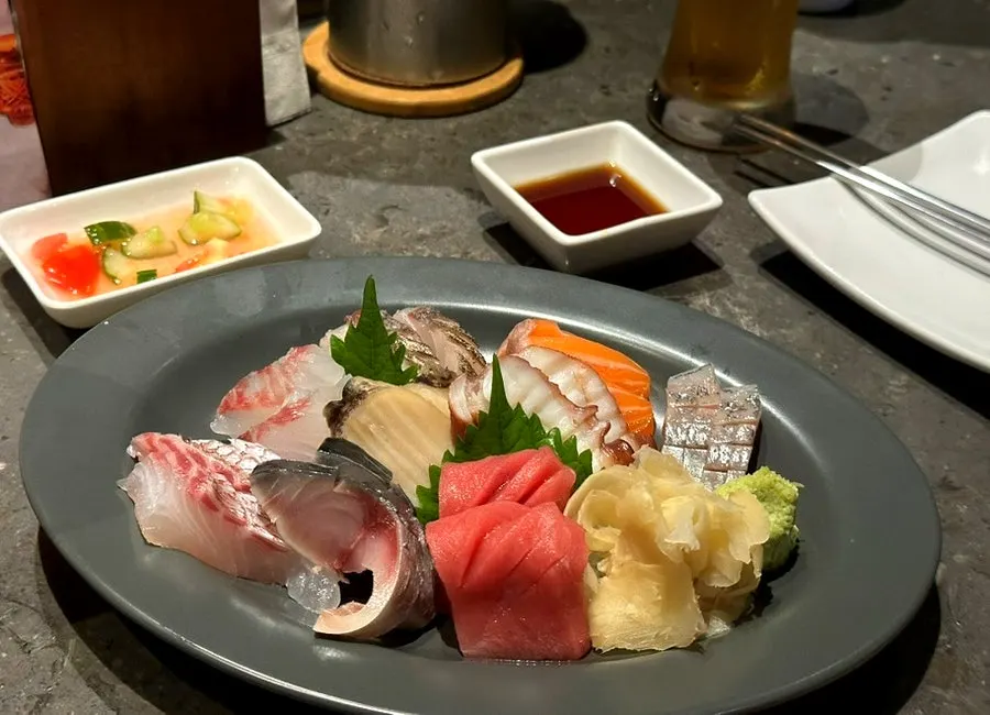 Yebisu draft beer and basic table setting on the bar table