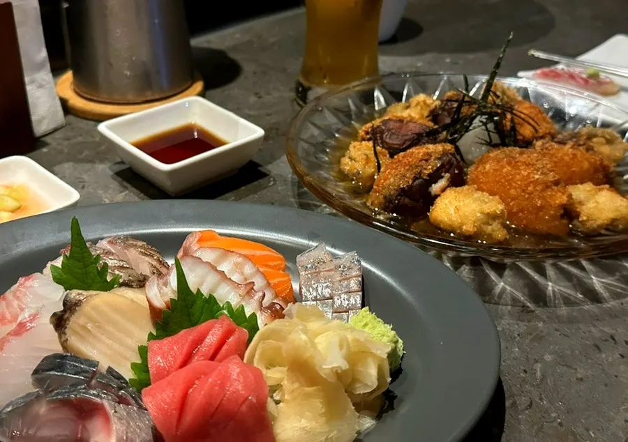 Fried abalone and beer set on the bar table