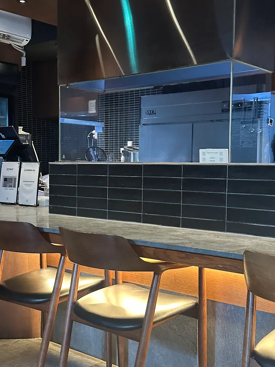 Sofa seats and bar table at Orot Robata