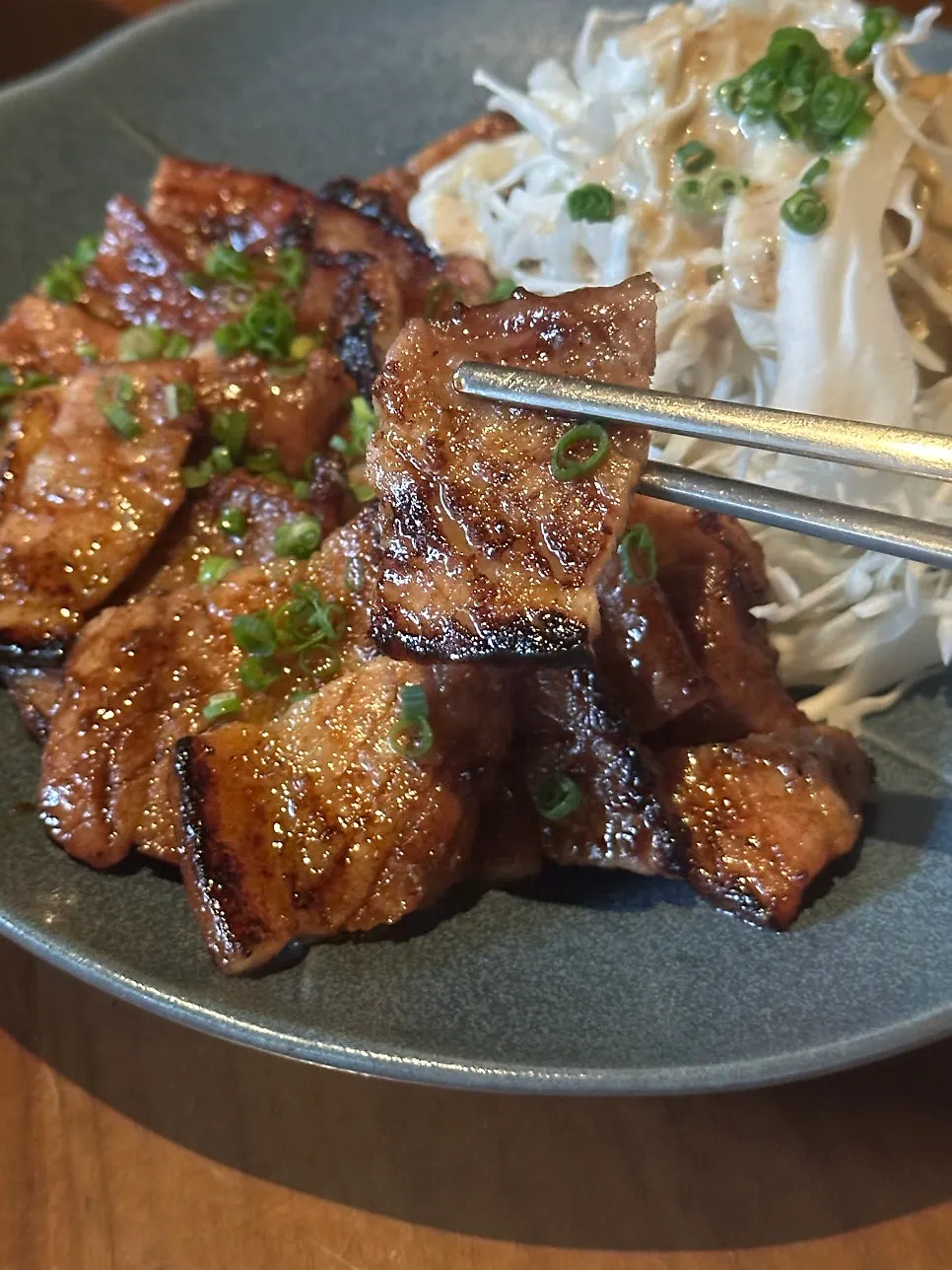 A smoky bite of buta teki charcoal grill