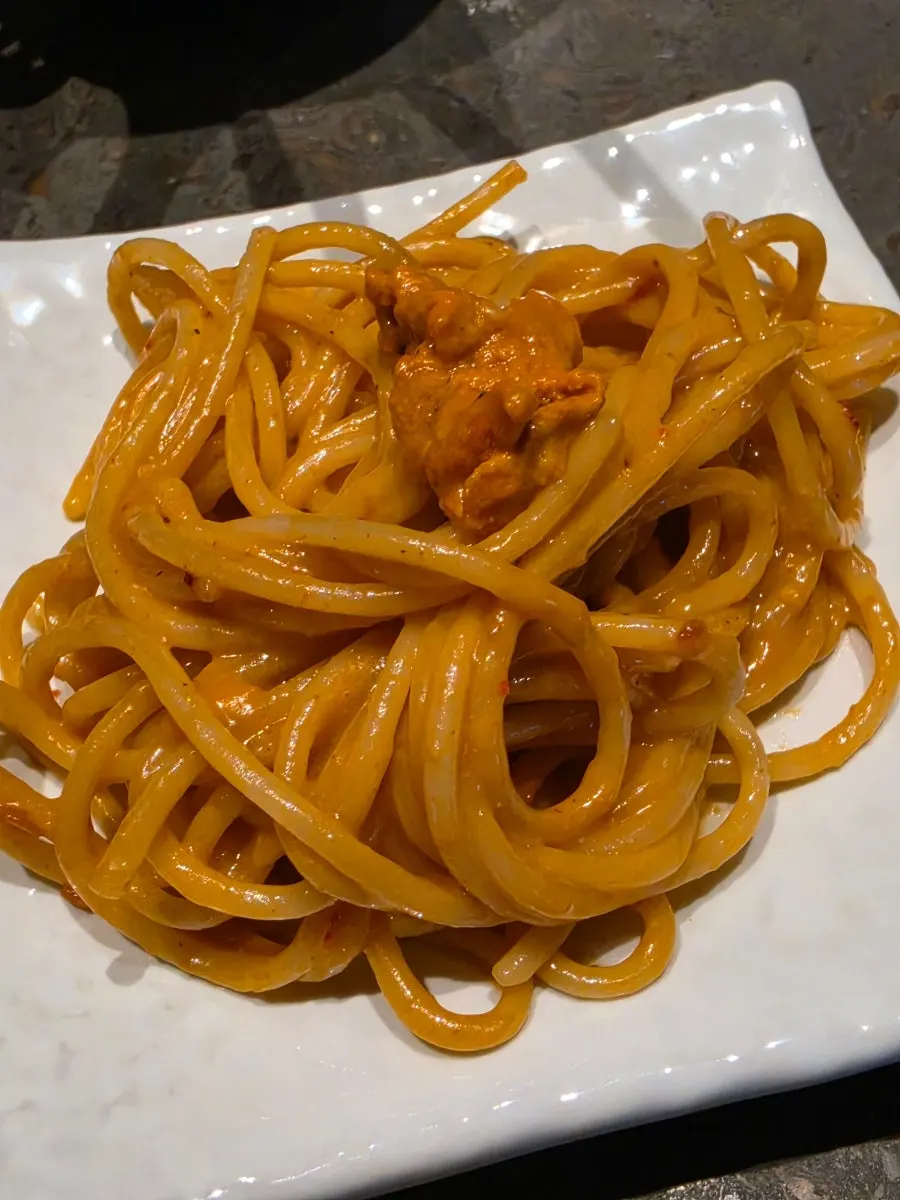 Cream pasta topped with sea urchin roe
