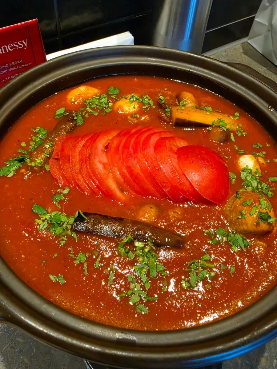 Table setting with tomato kaisen nabe