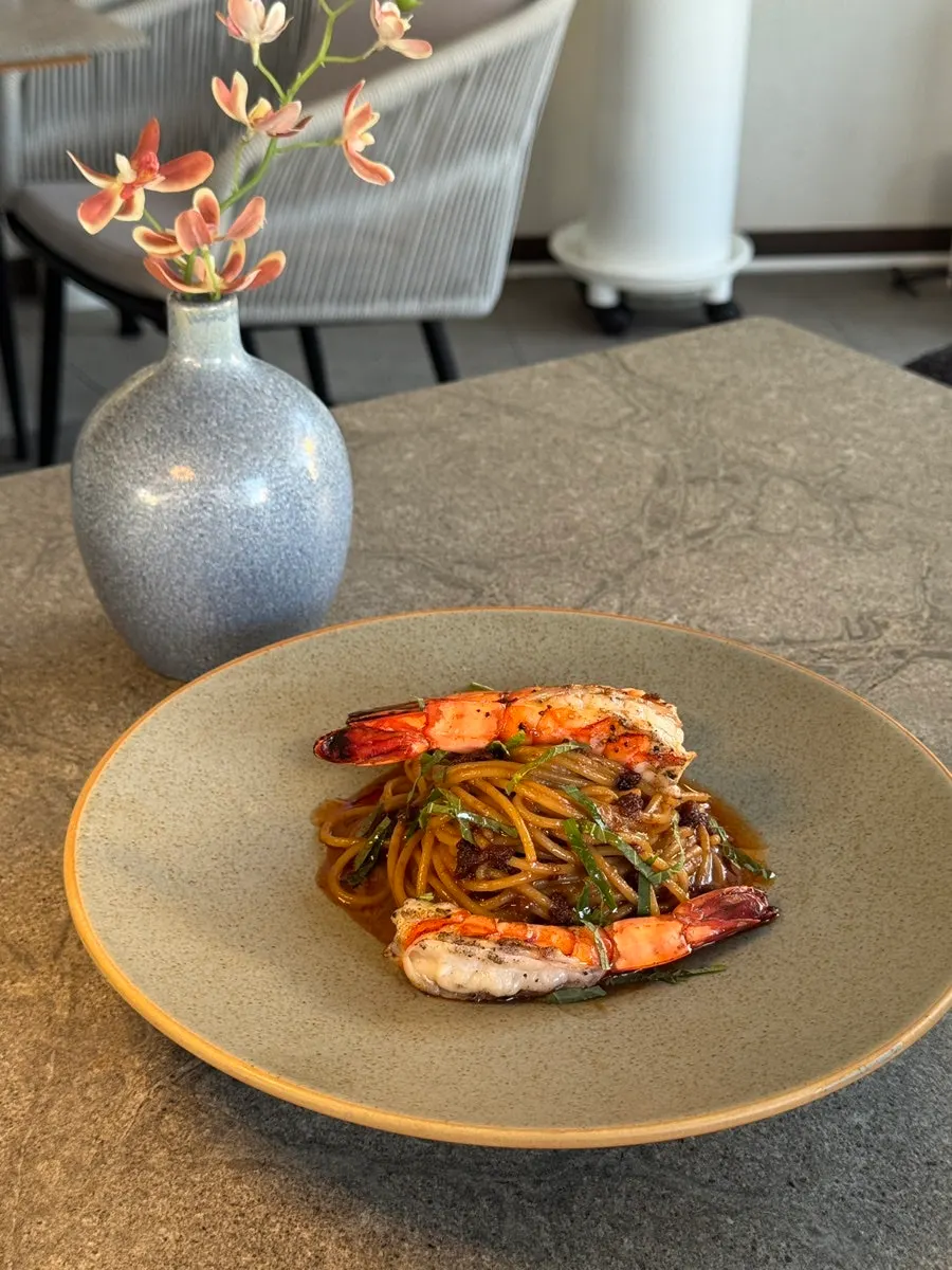 Tiger shrimp bisque pasta topped with black tiger shrimp