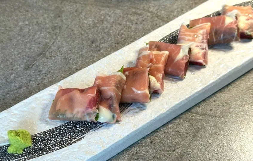 Raw tuna loin dish wrapped in prosciutto