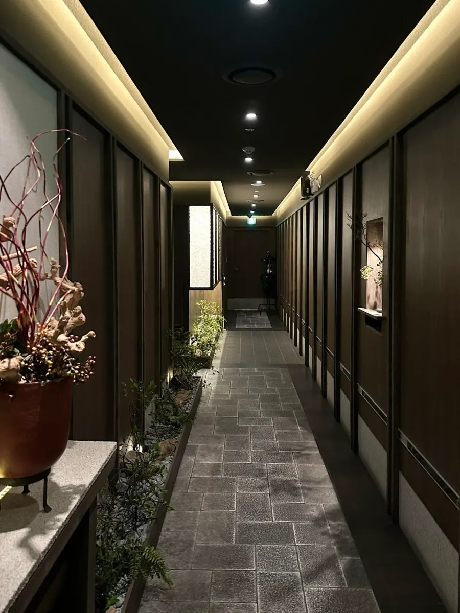 Modern hallway leading to the Osa Cheongdam rooms