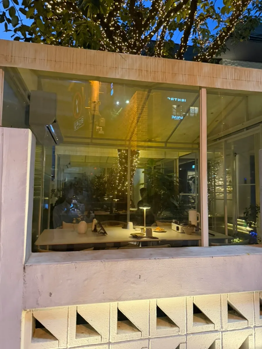 Interior of OSA Hannam with warm lighting and plants