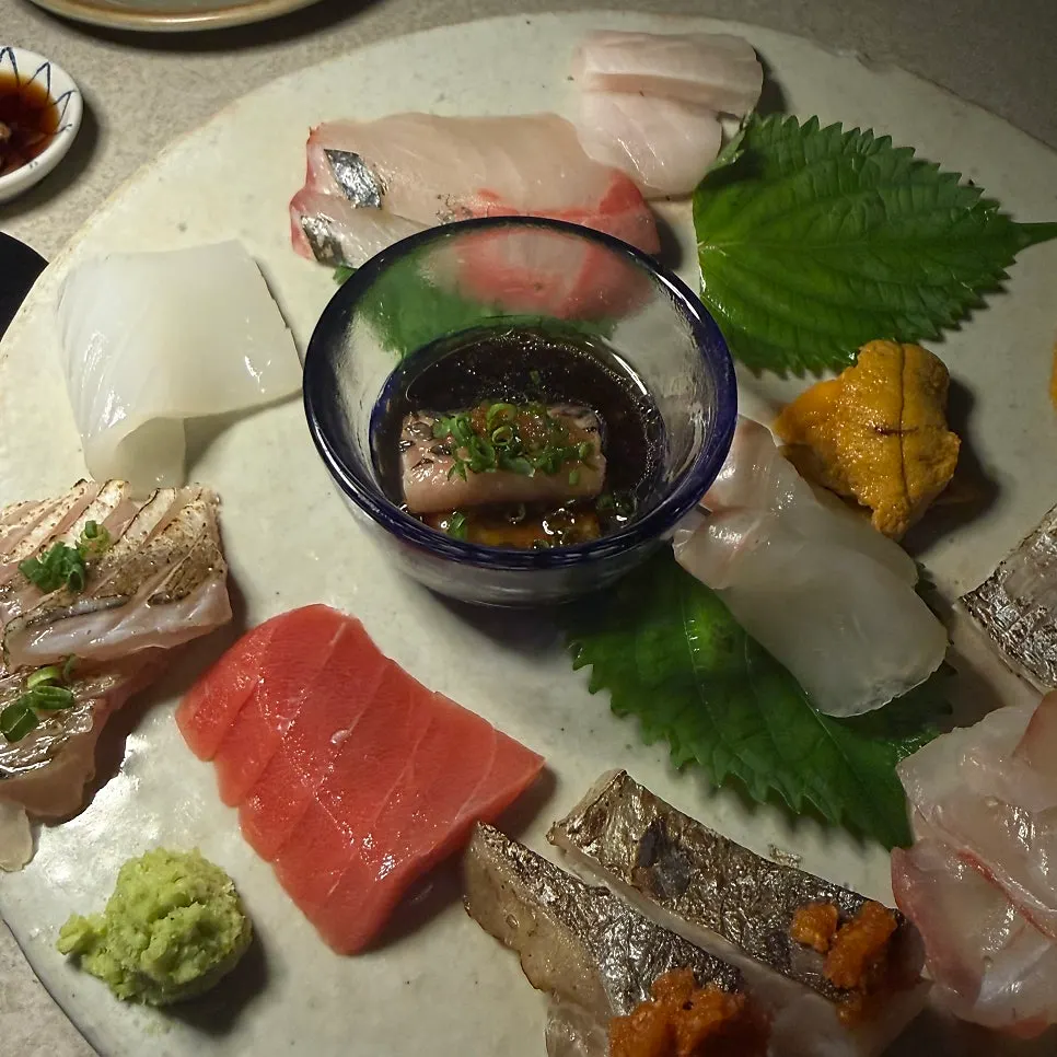Table setting with pickled shallots, pickled ginger, and special soy sauce