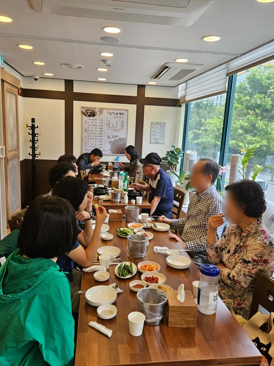 Customers seated in the samgyetang restaurant's hall