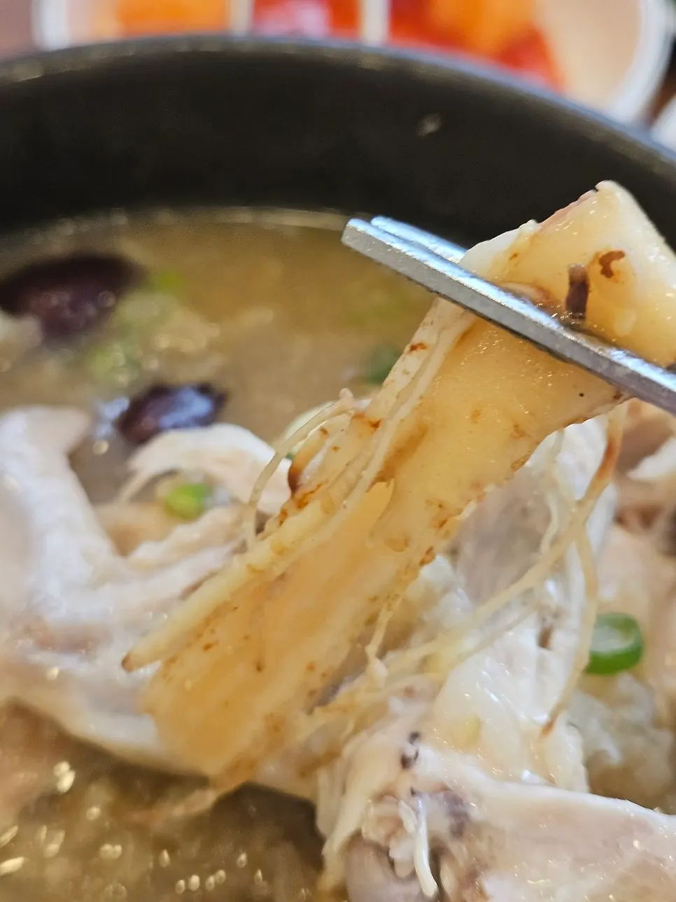 Inside the bowl showing the herbal ingredients in the samgyetang