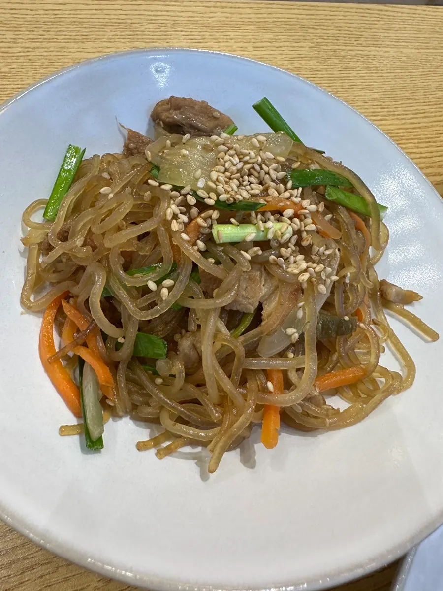 Plate of garlic bossam topped with garlic sauce
