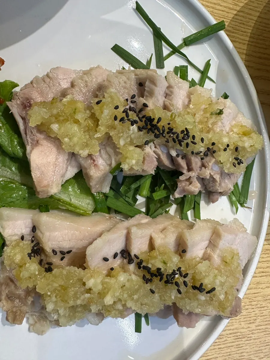 Close-up of a lettuce-wrapped bossam bite
