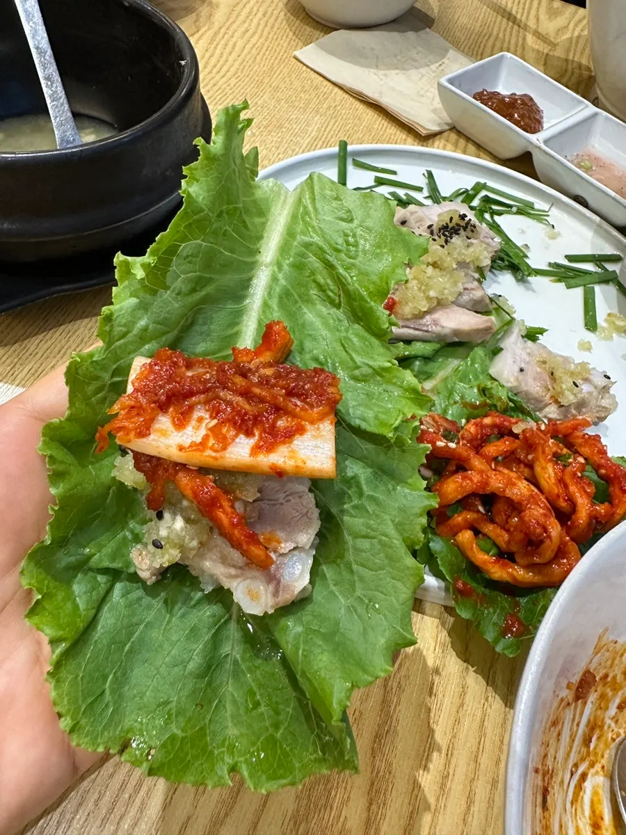 Table with bossam and stir-fried squid together