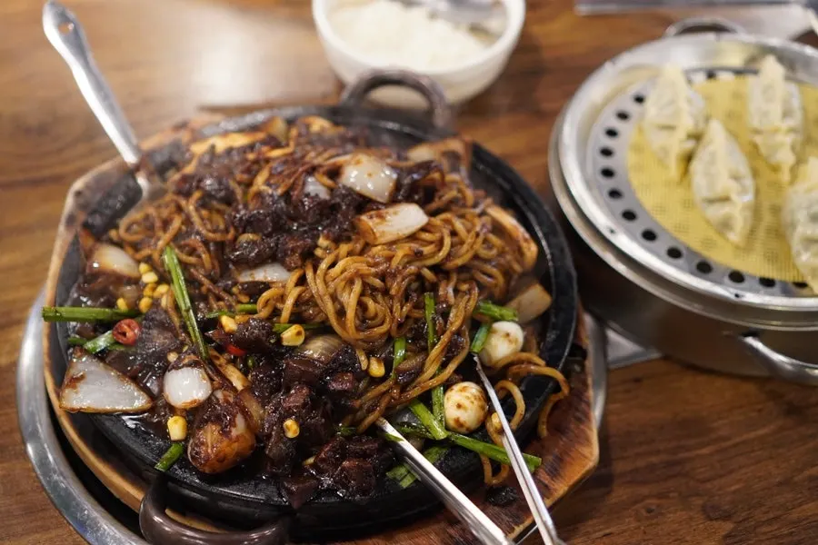 Stone-pot jjajang and complimentary steamed dumplings