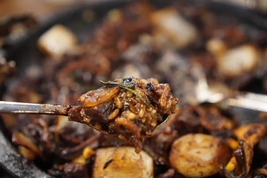 A generous stone plate of jjajang