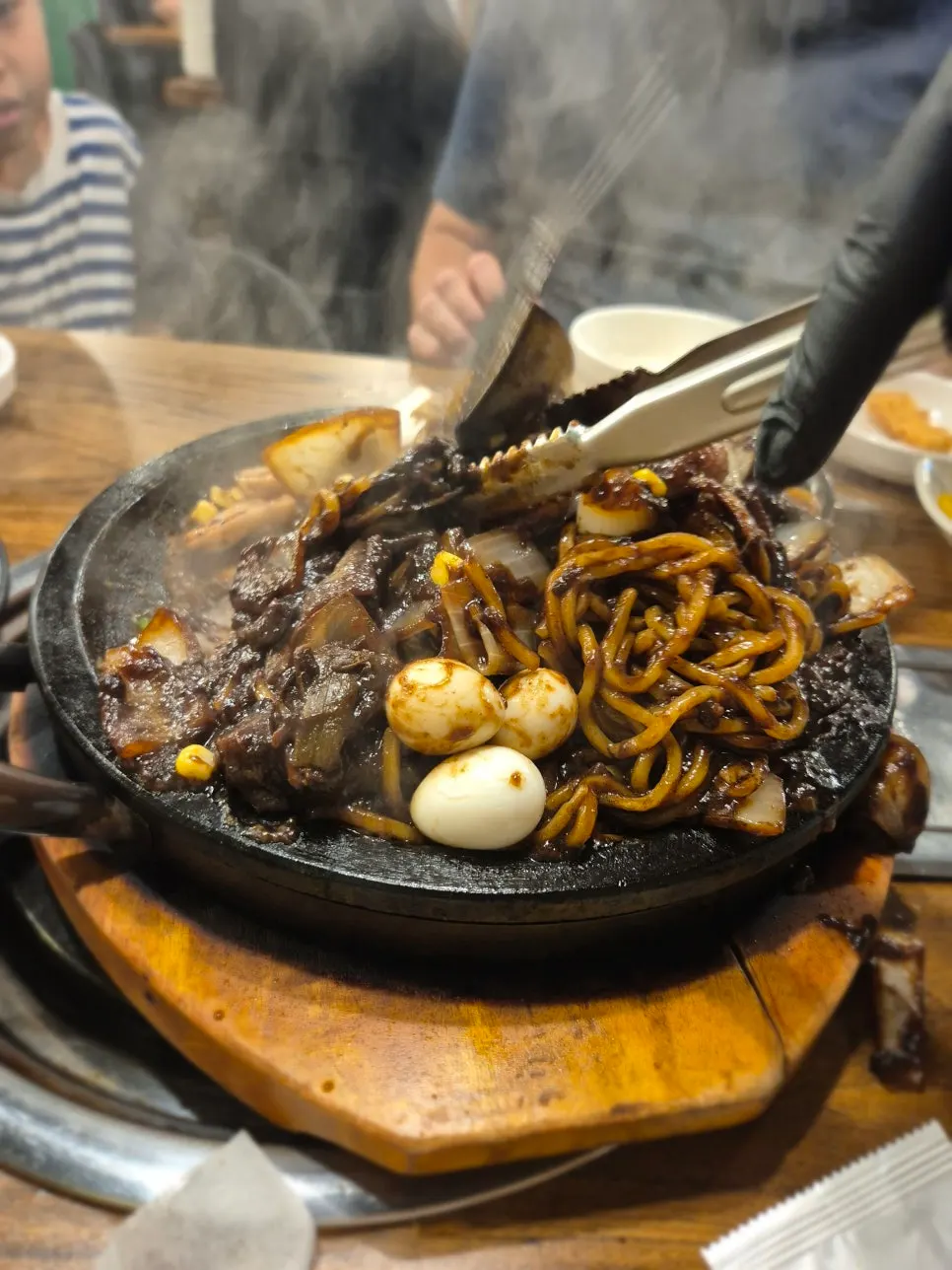 Table with stone jjajang, mandu and yuringi