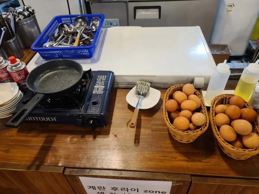 A table set with a baby chair and disposable apron