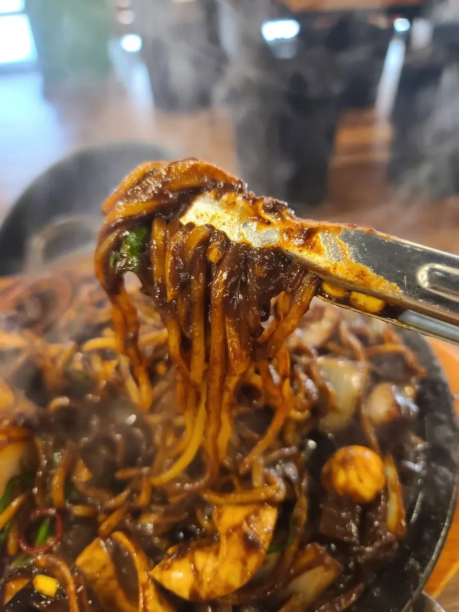 Noodles mixed and coated with jjajang sauce