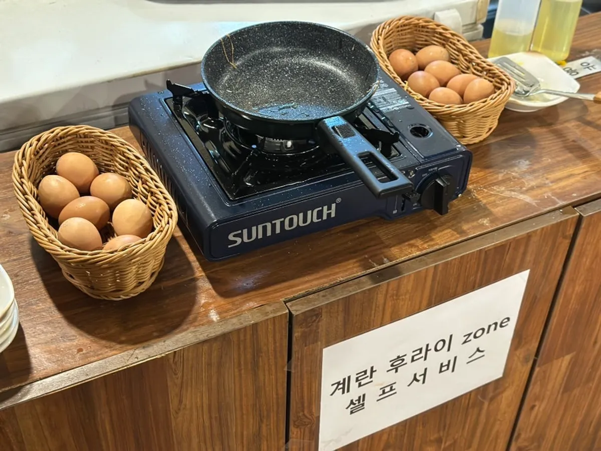 Self-serve fried egg station at Dami Sik