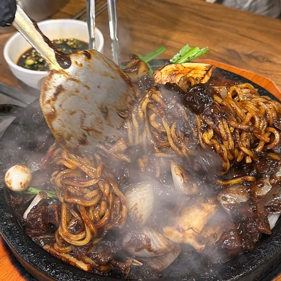 A full meal of stone jjajang, yuringi, and steamed dumplings