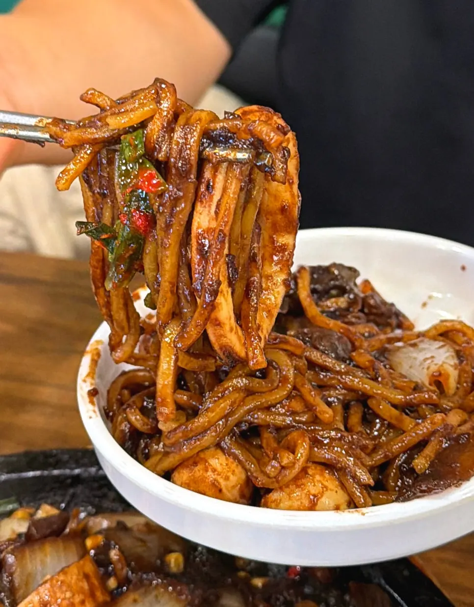 Seafood stone jjajang on a hot stone plate